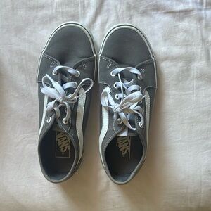 Dark grey vans , worn, still in good shape.